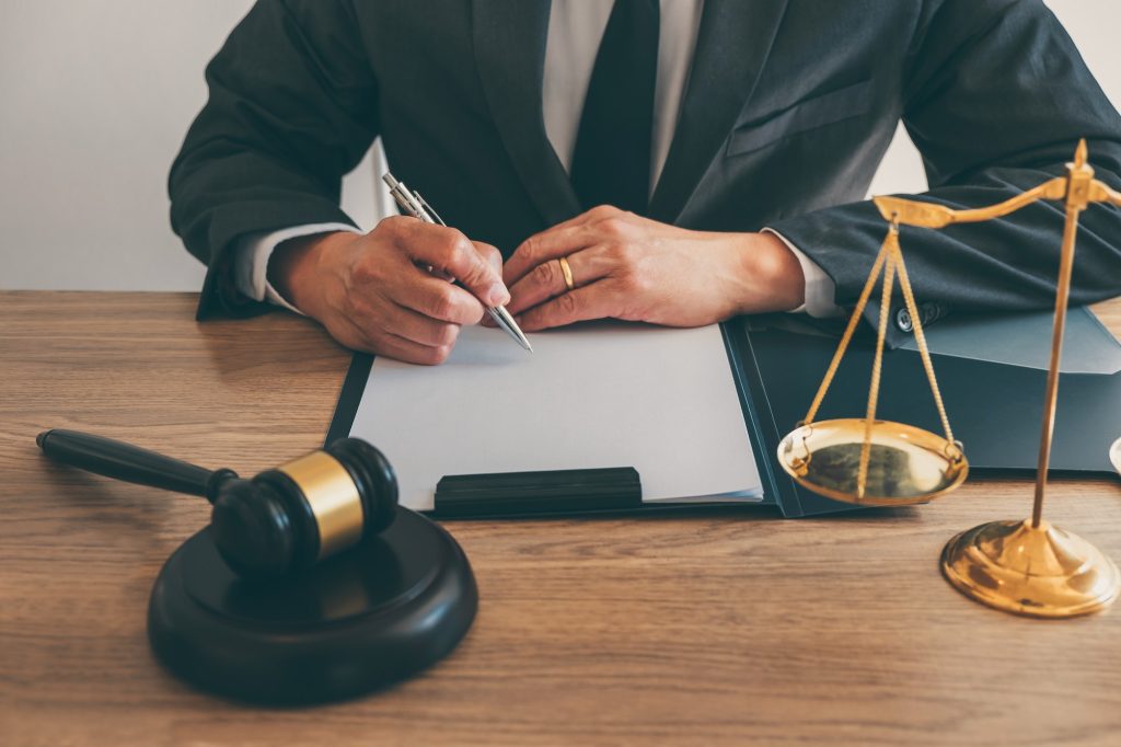 male lawyer working on a document